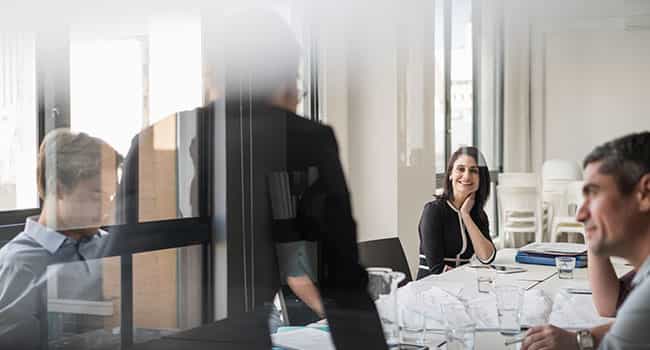 a commercial real estate adviser discusses real estate transaction management strategies with clients